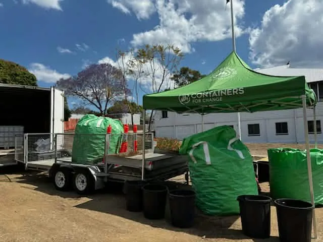 The Mount Morgan pop-up, a green Containers for Change tent with bag drop bags and a trailer